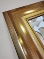 Duże lustro do przedpokoju w efektownej złotej ramie 100x180