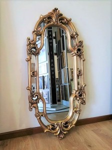 Owalne lustro w złotej ozdobnej ramie 60x120